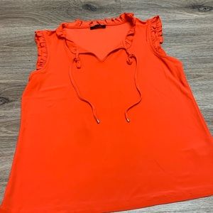 A cute coral/orange dress shirt for women in amazing condition!!
